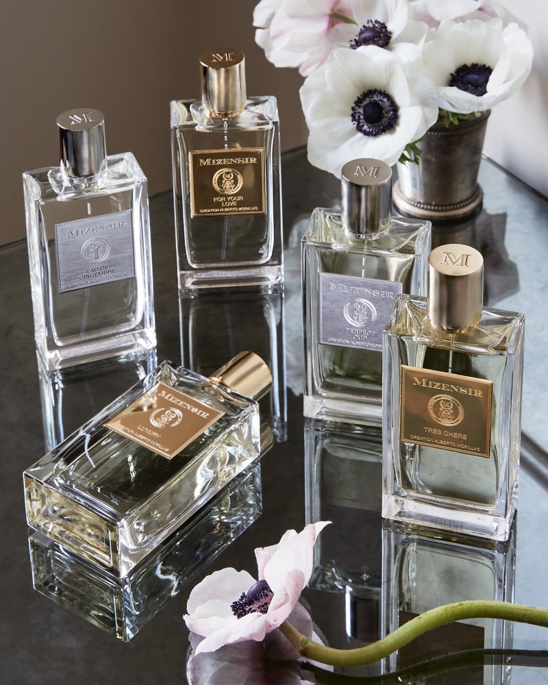 Mizensir perfume bottles collection with white anemones