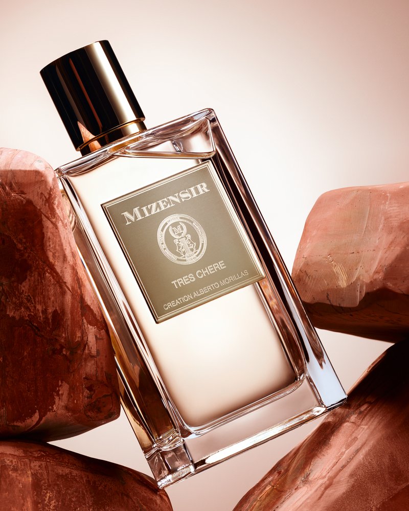 Tres Chere bottle by Mizensir, created by Alberto Morillas, on amber rocks
